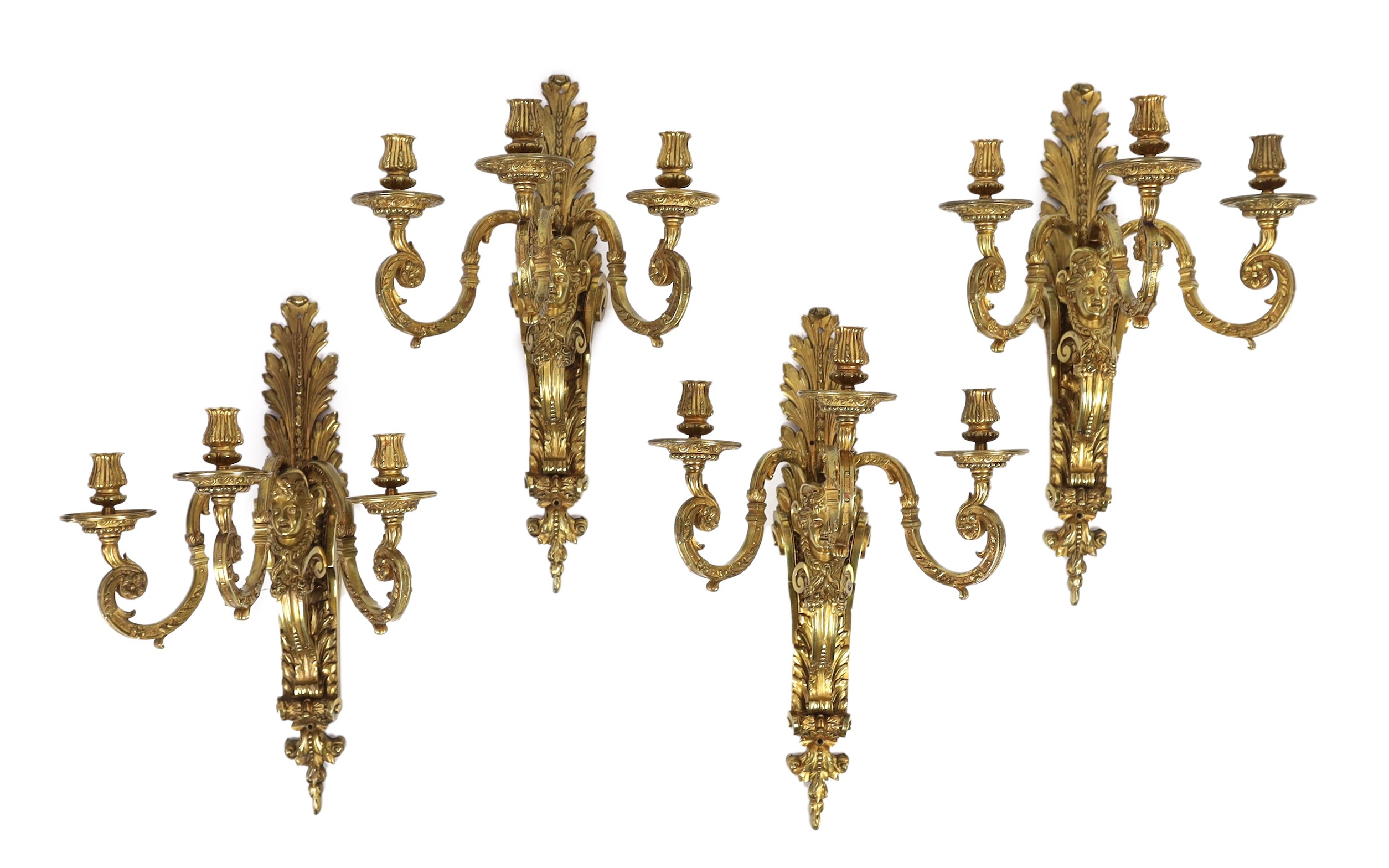 A set of four early 20th century Louis XVI style ormolu three branch wall lights, 41cm wide 62cm high